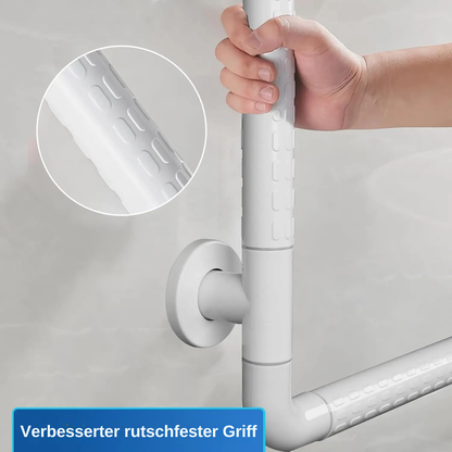 Hand haelt weissen Haltegriff mit rutschfester Struktur an der Wand